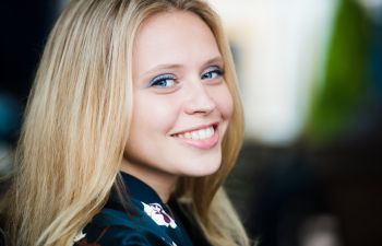 Happy woman blonde long-haired woman.