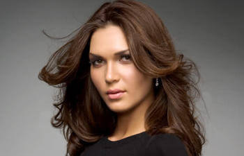 A beautiful woman with long dark hair.