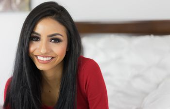 Custom Wigs New York NY|A happy middle-aged woman with shoulder-lenght hair.